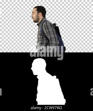 Portrait of man putting backpack on, Alpha Channel Stock Photo