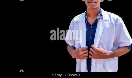 Cropped shot of an unrecognizable male doctor standing with hands holding a white coat Stock Photo