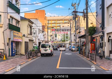 akihabara, japan - november 08 2019: Street decorated with Japanese paper lanterns announcing on the upper the enthronement of the new Emperor Naruhit Stock Photo