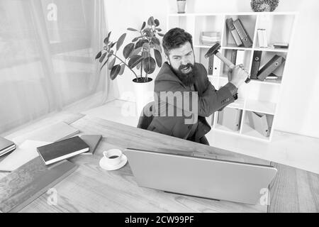 Software license agreement. Slow internet connection. Outdated software. Computer lag. Lagging system. Hate office routine. Man bearded crush computer. Destroy laptop. Hateful job. Bad computer. Stock Photo
