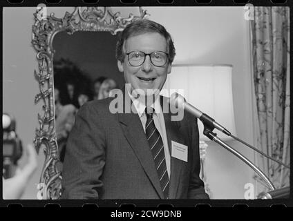 Smiling Senator Mitch McConnell, head-and-shoulders portrait, facing front, speaking at microphone at a gathering of Republican Party women candidates, Washington, DC, 6/1992. (Photo by Laura Patterson/CQ Roll Call Collection/RBM Vintage Images) Stock Photo