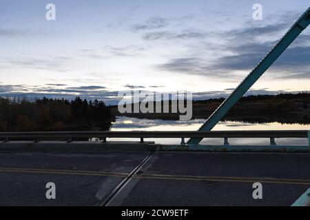 A steel truss bridge over the Bow River in Alberta Canada Stock Photo