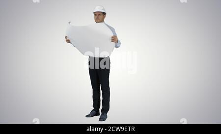 Engineer checking construction plan with what is built on gradie Stock Photo
