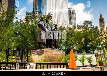 Chicago Heald Square Monument with Trump tower in background at summer Stock Photo