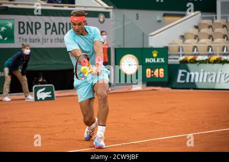 Paris, France. 28th Sep, 2020. Rafael Nadal returns the ball during the men's singles first round match between Rafael Nadal of Spain and Egor Gerasimov of Belarus at French Open tennis tournament 2020 at Roland Garros in Paris, France, Sept. 28, 2020. Credit: Aurelien Morissard/Xinhua/Alamy Live News Stock Photo