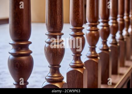 Perspective view of detail of ornate wooden balustrade in contemporary house with classic interior Stock Photo