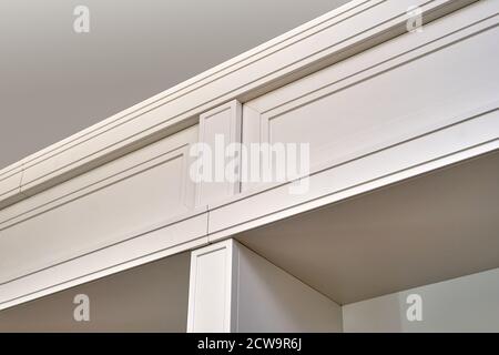 Detail of white wooden bookcase with empty shelves in home library Stock Photo