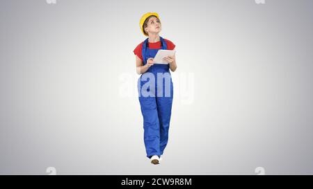 Woman construction worker with tablet checking construction site Stock Photo
