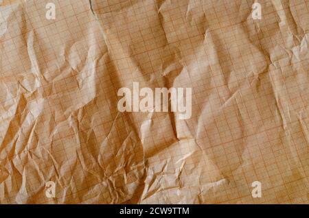 Texture of orange mint graphic paper for drawing. Detailed photo of mint and broken graph paper. Abstract multitask background. Stock Photo
