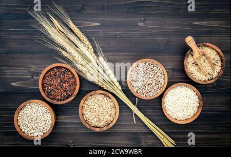 Various natural organic cereal and whole grains seed in wooden bowl for healthy food ingredient product concept. Stock Photo