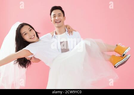 Happy young man picked up his girlfriend Stock Photo