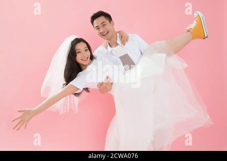 Happy young man picked up his girlfriend Stock Photo