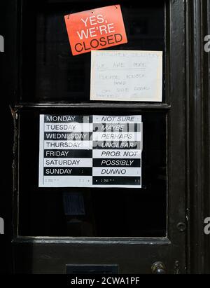 Uncertain notice about closure at a shop in the market town of Uppingham, Rutland, England, during the coronavirus epidemic, September 2020. Stock Photo