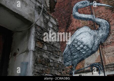 Street Art By Roa Of A Common Crane On A Large Brick Wall In Hanbury Street, London, UK Stock Photo