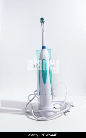 Electrical toothbrush on a white background. Stock Photo