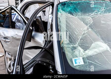 damaged vehicle closeup after a heavy crash, car wreck, broken windshield Stock Photo