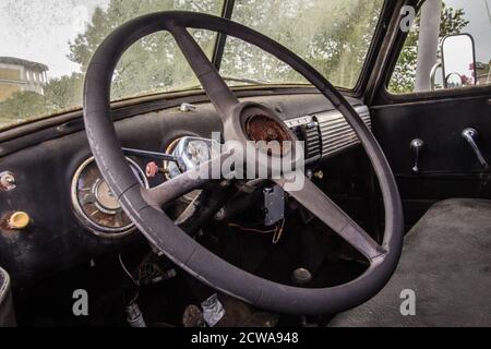 Sevierville, Tennessee, USA - August 15, 2020: Decaying interior dashboard of an antique Chevrolet truck. Stock Photo