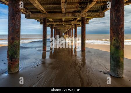 Underneath Southwold Pier at low tide, Suffolk, England, UK. Stock Photo