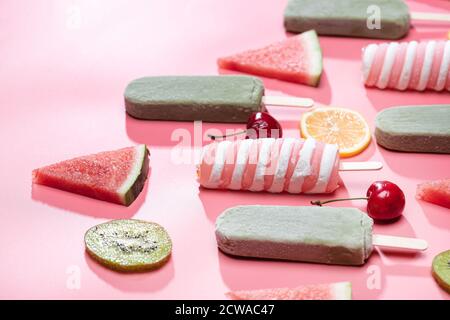 Different kinds of fruit and a variety of Popsicle Stock Photo