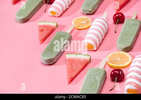 Different kinds of fruit and a variety of Popsicle Stock Photo