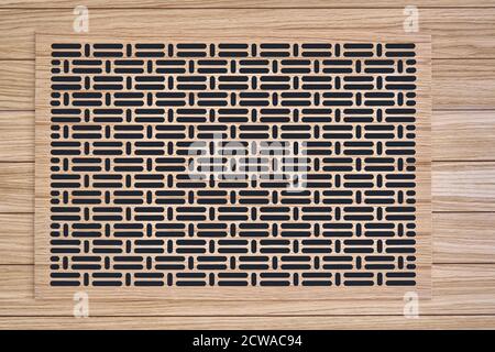 Decorative lattice. Wooden vent cover in wooden slats ceiling. Bottom view Stock Photo