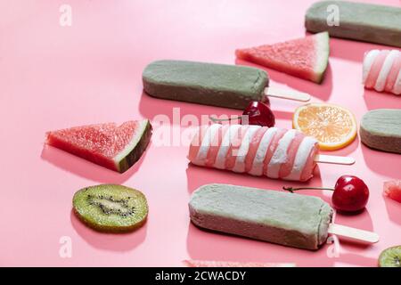 Different kinds of fruit and a variety of Popsicle Stock Photo