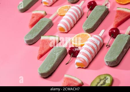 Different kinds of fruit and a variety of Popsicle Stock Photo