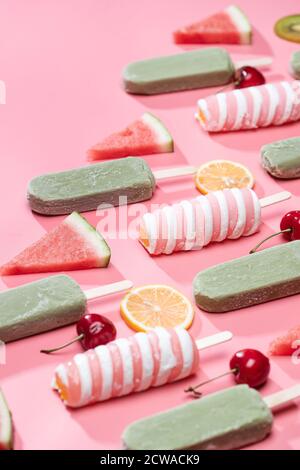 Different kinds of fruit and a variety of Popsicle Stock Photo