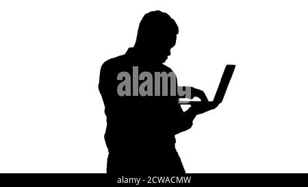 Silhouette Afro American business man working with laptop. Stock Photo