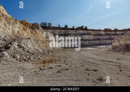 Inside open chalky quarry pit in autumn Stock Photo