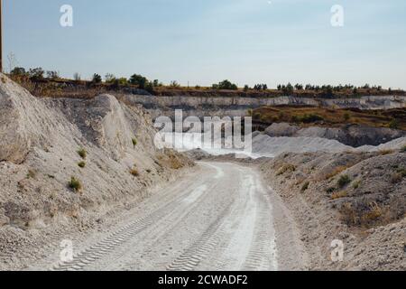 Inside open chalky quarry pit in autumn Stock Photo