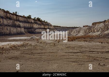 Inside open chalky quarry pit in autumn Stock Photo