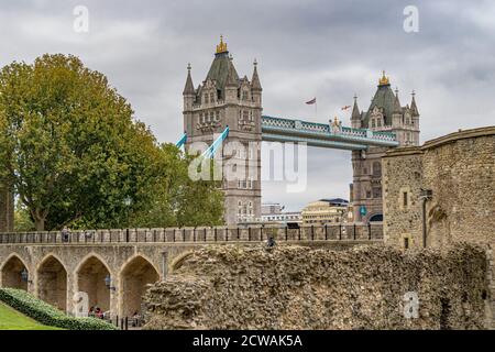 Tower Bridge, a world famous London landmark seen from inside the walls of The Tower Of London , London EC3 Stock Photo