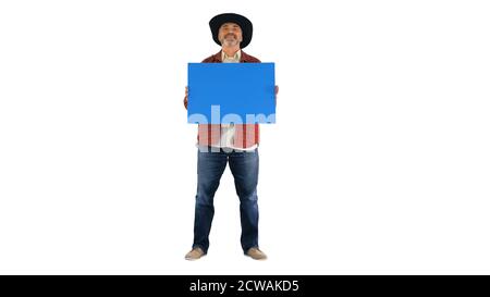 Senior farmer in a hat holding blank placard on white background Stock Photo