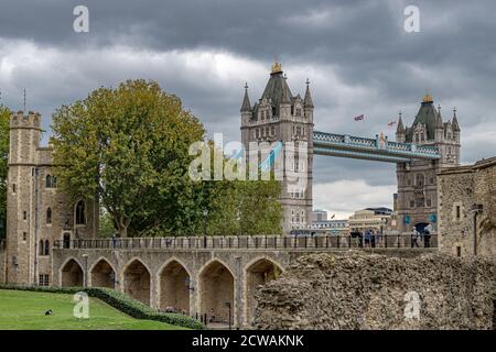 Tower Bridge, a world famous London landmark seen from inside the walls of The Tower Of London , London EC3 Stock Photo