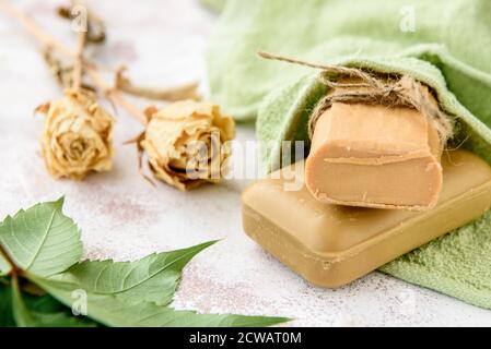 Pieces of household soap on a light vintage background Stock Photo