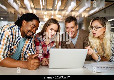 Successful company with happy employees in modern office Stock Photo