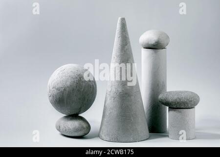 Abstract background with composition of different grey geometric objects and stones. Copy space. Modern concept for product presentation. Stock Photo