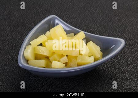 Marinated pineapple pieces in the bowl Stock Photo