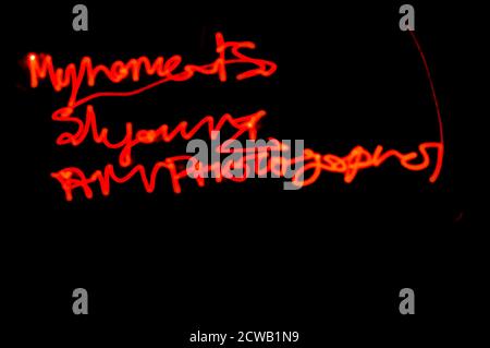 Red laser beam ,light creating pattern on black surface, space for text. Stock Photo