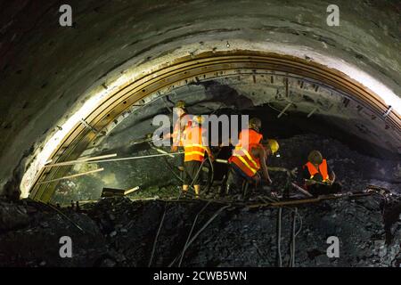 Vientiane, Laos. 28th Sep, 2020. Workers are busy at the construction site of the Xiang Ngeun No. 3 Tunnel in Luang Prabang Province, Laos, Sept. 28, 2020. Xiang Ngeun No. 3 Tunnel, the last tunnel along the China-Laos Railway, was drilled through on Tuesday. So far, all the 75 tunnels across the China-Laos Railway have been holed. The successful completion of the tunnels indicates that the controlling factors affecting the China-Laos railway project have basically been removed. Credit: Kaikeo Saiyasane/Xinhua/Alamy Live News Stock Photo