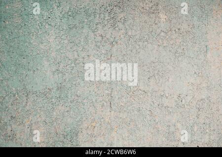 Corroded metal background. Oxidized metal texture with brass and aqua patina, rusty metal surface with streaks of rust. Stock Photo