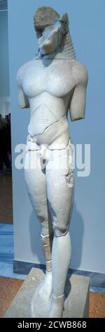 Statue of a Kouros made of Naxian marble, found in Athens where he originally stood above a grave. Stock Photo