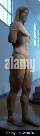 Statue of a Kouros made of Naxian marble, found in Athens where he originally stood above a grave. Stock Photo