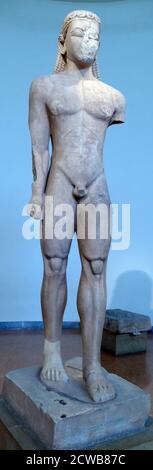 Statue of a Kouros made of Naxian marble, found in Athens where he originally stood above a grave. Stock Photo