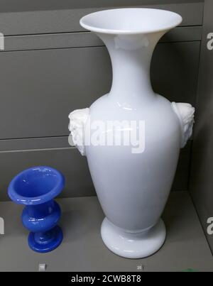 Blue glass 19th century Swiss Medici vase with large white opal glass vase by Baccarat 1851 Stock Photo