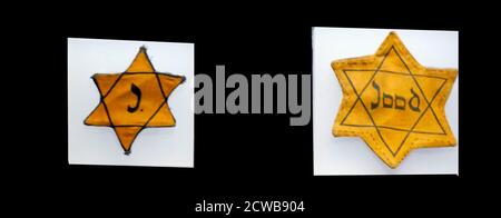 Dutch and German Yellow badges (or yellow patches), (Judenstern), that Jews wore in Nazi occupied Europe. Stock Photo
