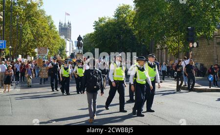 Policing during the Climate emergency demonstration in London, 26th September 2019. The September 2019 climate strikes, (Global Week for Future), were a series of international strikes and protests to demand action be taken to address climate change. The strikes took place from 20-27 September. The protests took place across 4,500 locations in 150 countries. Stock Photo