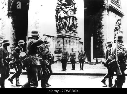 German troops marching past the Arc de Triomphe, Paris, 14 June 1940, the day the city fell to the invaders. The photographer is unknown. Stock Photo