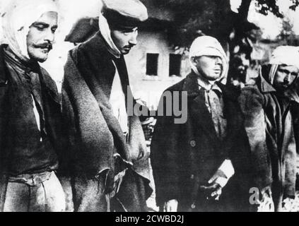 Freed prisoners from the concentration camp at Salaspils, Latvia, liberated by the Red Army in 1944. An estimated 53,000 people died at the camp, run by Latvian collaborators. The photographer is unknown. Stock Photo